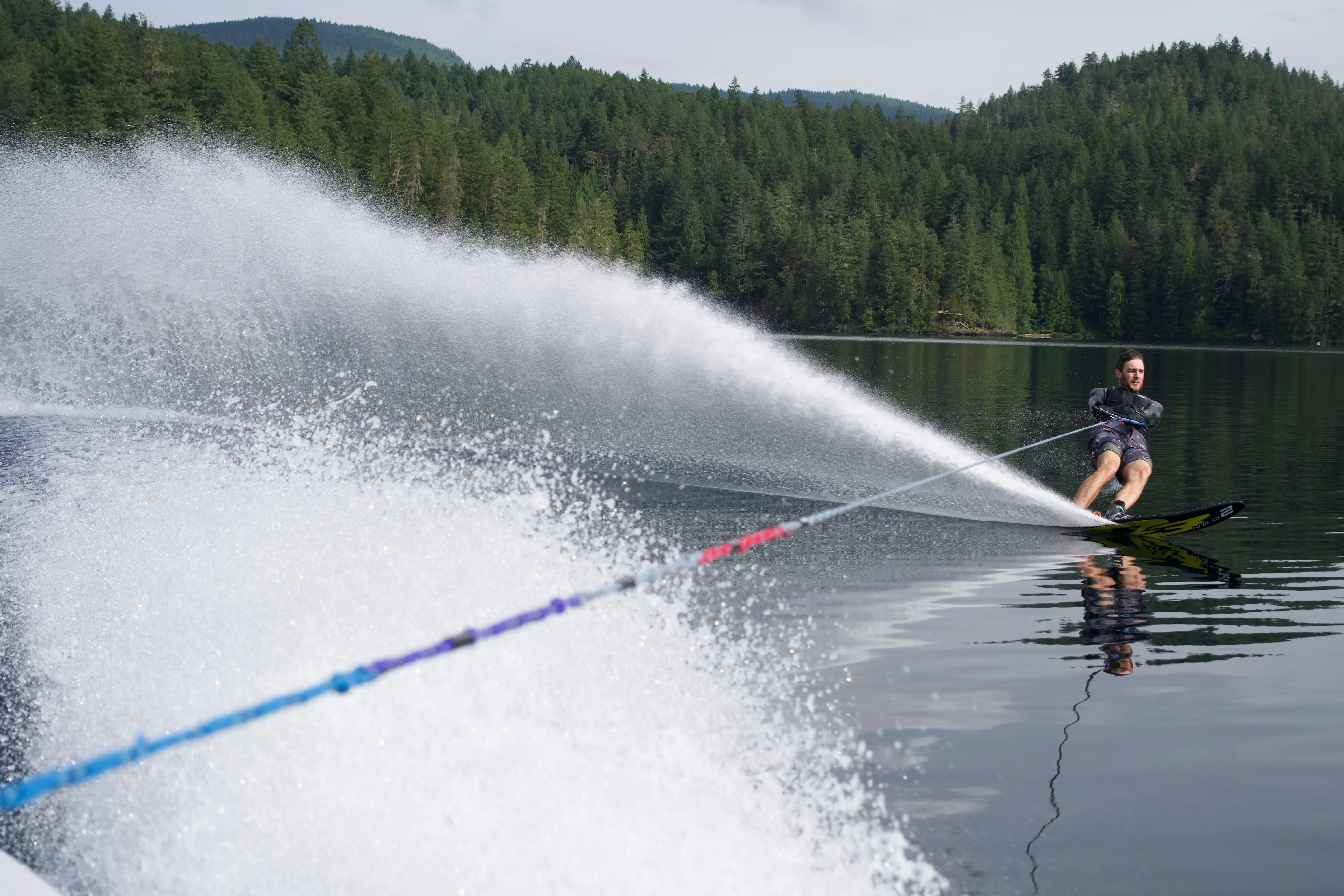 Slalom waterskiing on Ruby Lake with a dramatic spray of water