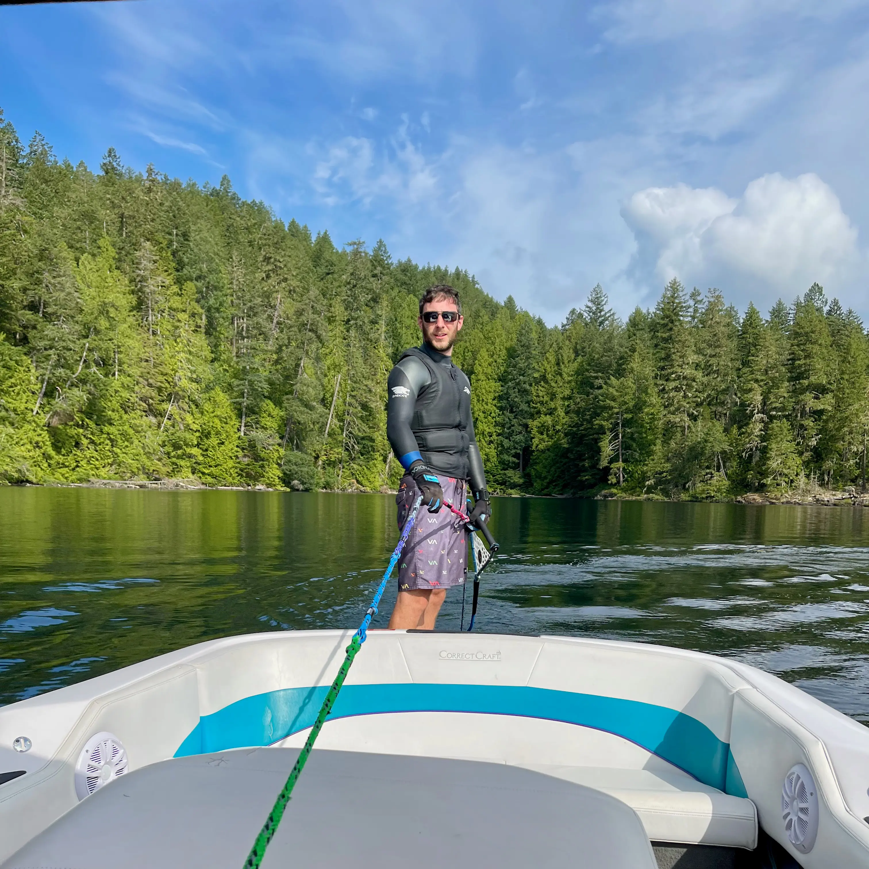 Jon standing at the back of the boat ready to ski
